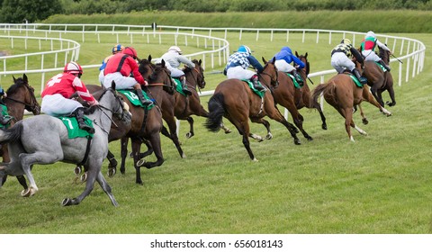 Horse Race Taking The Final Turn Towards The Finish Line