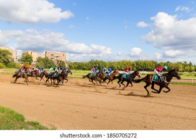 horse racing with jockeys racetrack on a Sunny summer day stallions race the first winner of the race - Powered by Shutterstock