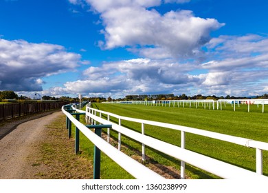 Horse Racing Track sunny blue sky green grass
