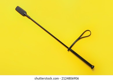 Horse Riding Crop On Yellow Background