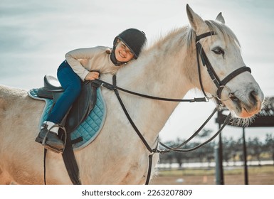 .Horse riding, young equestrian and portrait of a girl on a animal in the countryside. Farm, summer and horses training outdoor on farming field with a happy kid smile learning to ride for sport. - Powered by Shutterstock