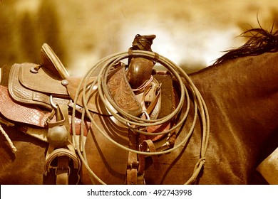 A horse and saddle in a sepia tone.