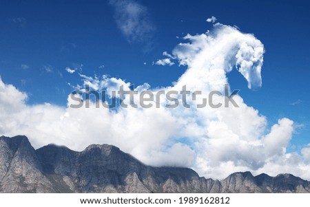 horse shape cloud on bright blue sky
