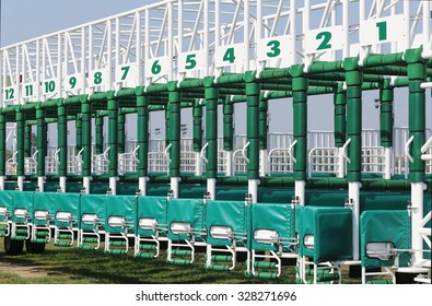  Horse track with starting gates at a race track summertime