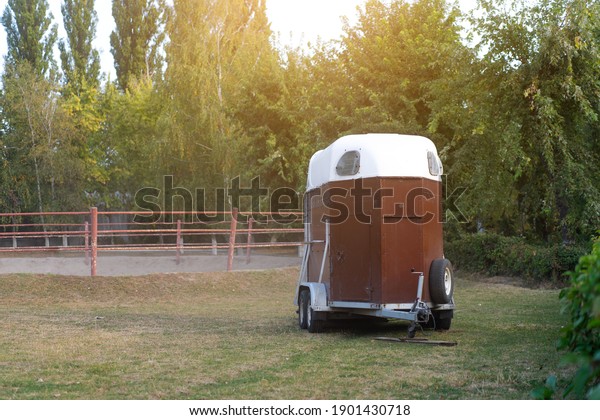Horse trailer standing outdoor . vehicle\
for horse transportation Travel with animals\
