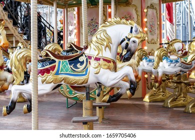 Horse in vintage style on a children's circular carousel.