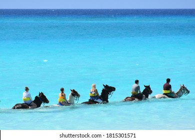 Horseback riding tour social distanced the in ocean, visitors / travel scene in the Caribbean - Powered by Shutterstock