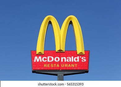 Horsens, Denmark - September 30, 2015: McDonald's logo on a pole. McDonald's is the world's largest chain of hamburger fast food restaurants