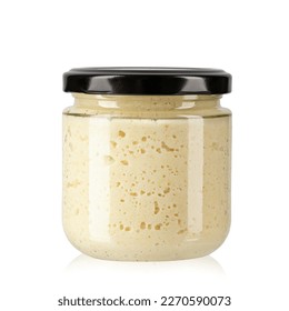 Horseradish in a transparent glass jar. Isolated on white background. File contains clipping path