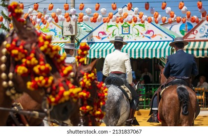 horses and riders at the Spanish fiesta - Shutterstock ID 2131837067
