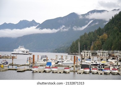 Horseshoe Bay BC, Canada - October 17, 2020:  The Horseshoe Bay to Nanaimo BC ferry sailing into the ferry terminal at SewellÕs Marina.  West Vancouver, BC, Canada.