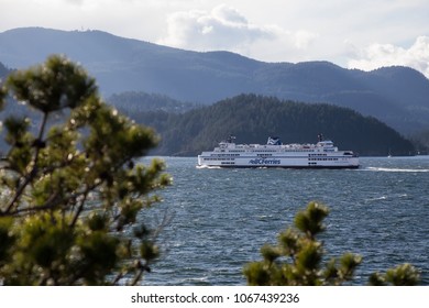 Horseshoe Bay, West Vancouver, British Columbia, Canada - April 1, 2018: BC Ferry is leaving the terminal during stormy and windy day.