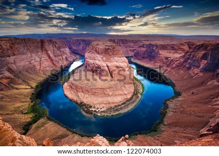 Horseshoe Bend, canyon and Colorado river at sunset.