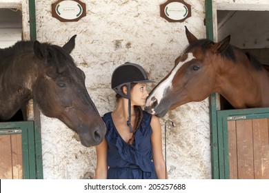 horsewoman with his horses - Powered by Shutterstock