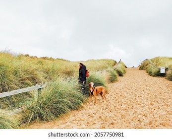 Horsey, UK-10-10-2021: Dog Walkers At Horsey Gap Beach, UK