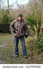 Horsham, West Sussex, UK-February 23 2022: A Hunter With A Hunting Rifle In The UK. 