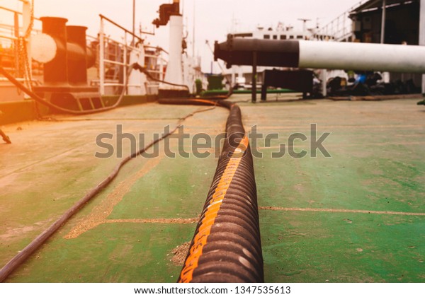 Hose for\
exhaustion oil waste on board oil\
tanker.