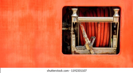 Hoses To Quench The Fire And Fire Rolling Extinguisher In Fire Truck.