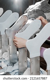 Hosiery factory. Mass production of clothing. Stacking and laying socks. Socks in different colors and sizes. Tights, leggings, stockings, stockings. Underwear. Textile products. Hand layout. 