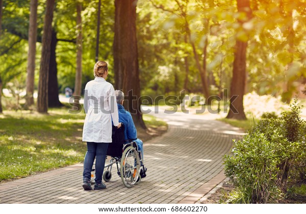 Hospice Nurse Helping Elderly Man On Stock Photo 686602270 | Shutterstock