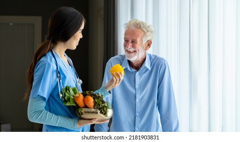 Hospice Nurse And Nutritionist Is Suggesting Variety Of Vegetable To Caucasian Man At Pension Retirement Center For The Home Care Rehabilitation And Longevity Post Treatment Recovery Process