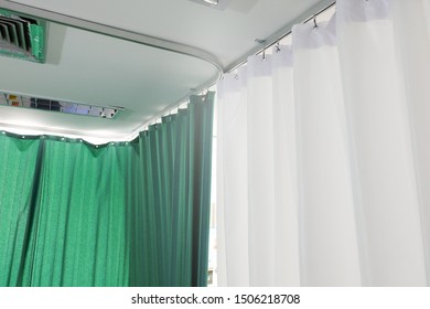 green​ and​ white​ curtain​s​ in​ the​ waiting​ room​ at​ the​ hospital.