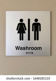 A Hospital Bathroom Sign With A Female And Male Sign