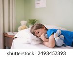 Hospital, bed and portrait of boy with teddy bear, smile and medical consultation for kids healthcare. Relax, healing and child in bedroom at clinic with stuffed animal, professional care and health.