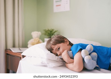 Hospital, bed and portrait of boy with teddy bear, smile and medical consultation for kids healthcare. Relax, healing and child in bedroom at clinic with stuffed animal, professional care and health. - Powered by Shutterstock