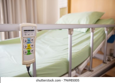 Hospital bed remote control hanging on the bed rail. technology of medical and hospital services. image for background, objects, copy space, illustration and article.