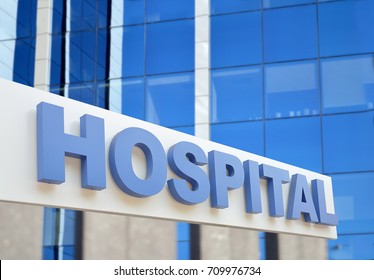Hospital Building Sign Closeup, With Sky Reflecting In The Glass. 3d Rendering