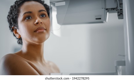 In the Hospital, Close Up Portrait Shot of Topless Latin Female Patient Undergoing Mammography Screening Procedure. Healthy Young Female Does Cancer Preventive Mammogram Scan in Radiology Room.