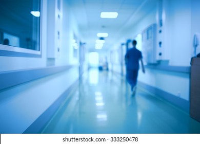 Hospital Corridor And Doctor As A Blurred Defocused Background