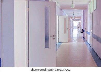 Hospital Corridor With Open Doors To Wards And A Nurse Bypass