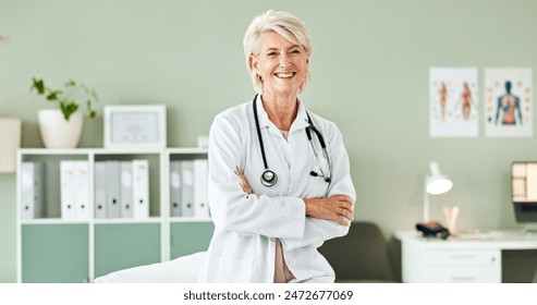 Hospital, crossed arms and portrait of mature doctor with stethoscope for medical career, support and health. Clinic, healthcare and professional woman for cardiology, pulmonary service and wellness - Powered by Shutterstock