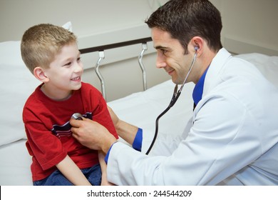 Young Male Doctor Gives Physical Examination To Cute 