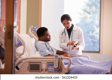 Hospital Doctor With Digital Tablet Talks To Male Patient - Powered by Shutterstock