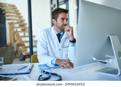 Hospital, doctor and man on computer in office for consulting, medical service and telehealth. Healthcare, clinic and person on digital tech for website, online research and insurance for wellness - Powered by Shutterstock