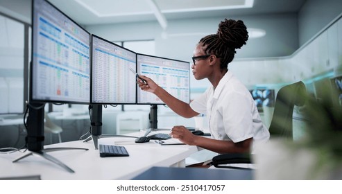 Hospital Doctor Using Spreadsheet For Billing Codes On Desktop - Powered by Shutterstock