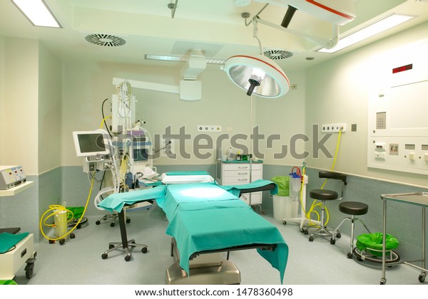 Hospital equipped surgery room.\
Health care assistance.  Clinical instruments.\
Indoor