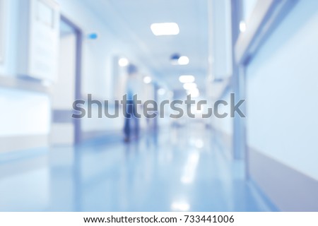 Hospital hallway, unfocused background.