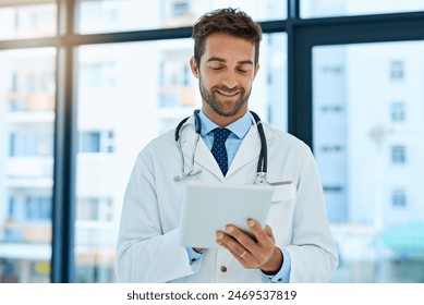 Hospital, healthcare and man doctor with tablet for patient diagnosis, review charts or consultation. Online, wellness and physician with tech for telehealth, medical analysis or schedule surgery - Powered by Shutterstock