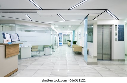 Hospital interior, entrance hall of clinic. Panorama inside new empty hospital, bright 1 floor with ceiling LED lighting. Panoramic view of modern clean hallway, white design. Moscow - Dec 14, 2016 