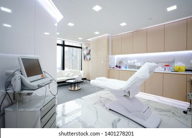 Hospital interior with operating surgery table, lamps and ultra modern devices, technology in modern clinic.