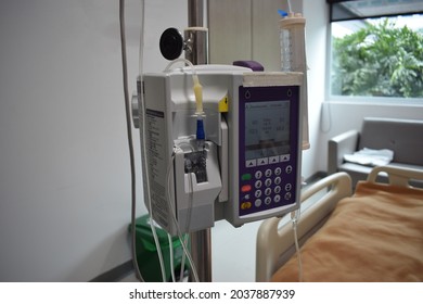 Hospital Intravenous Pump A+ Located In A Hospital Room. Translation: 