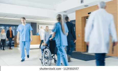 Hospital Lobby. Doctors, Nurses, Assistant Personnel And Patients Working And Walking In The Lobby Of The Medical Facility.