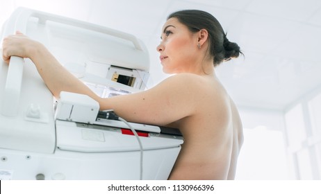 In the Hospital, Low Angle Portrait Shot of Topless Female Patient Undergoing Mammogram Screening Procedure. Healthy Young Female Does Cancer Preventive Mammography Scan. Modern Hospital. - Shutterstock ID 1130966396