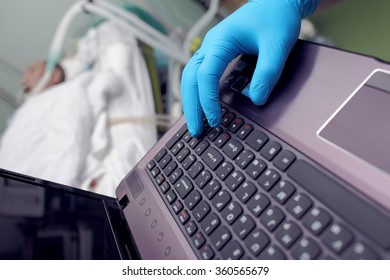 Hospital Management Concept, Doctor's Hand Working On A Computer In The Background Of The Patient