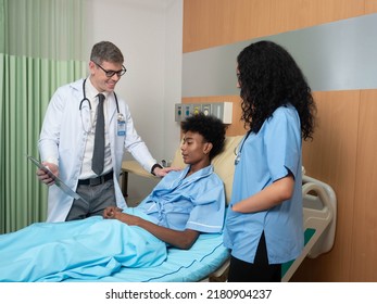 At Hospital Patient Lay On Bed Doctor And Nurse Explain About Sickness Good Improvement Report
