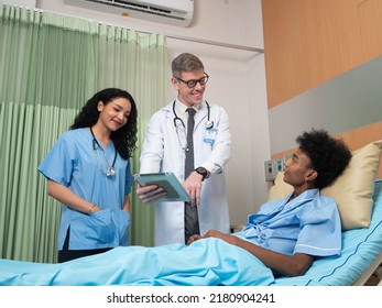 At Hospital Patient Lay On Bed Doctor And Nurse Explain About Sickness Good Improvement Report
